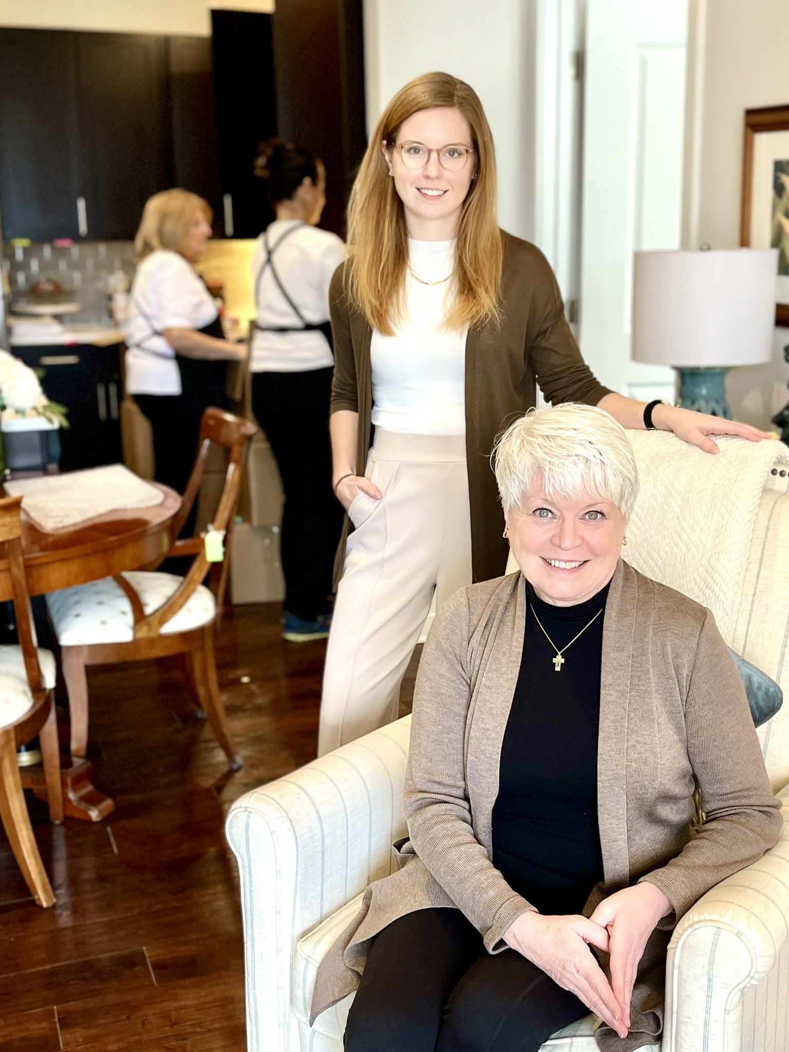 Jill Kearney and daughter, Lindsay Kearney-Flowers, with move day preparations in the background.